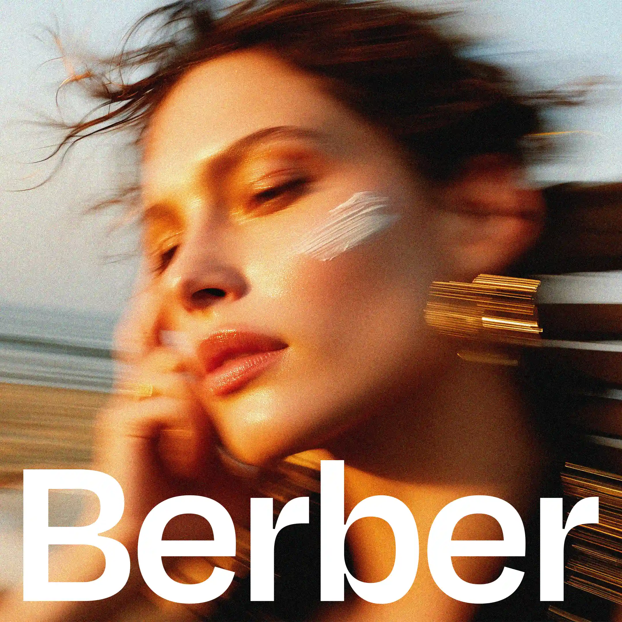 Close-up of woman with sunscreen, dynamic shot, Berber brand, healthy skin.