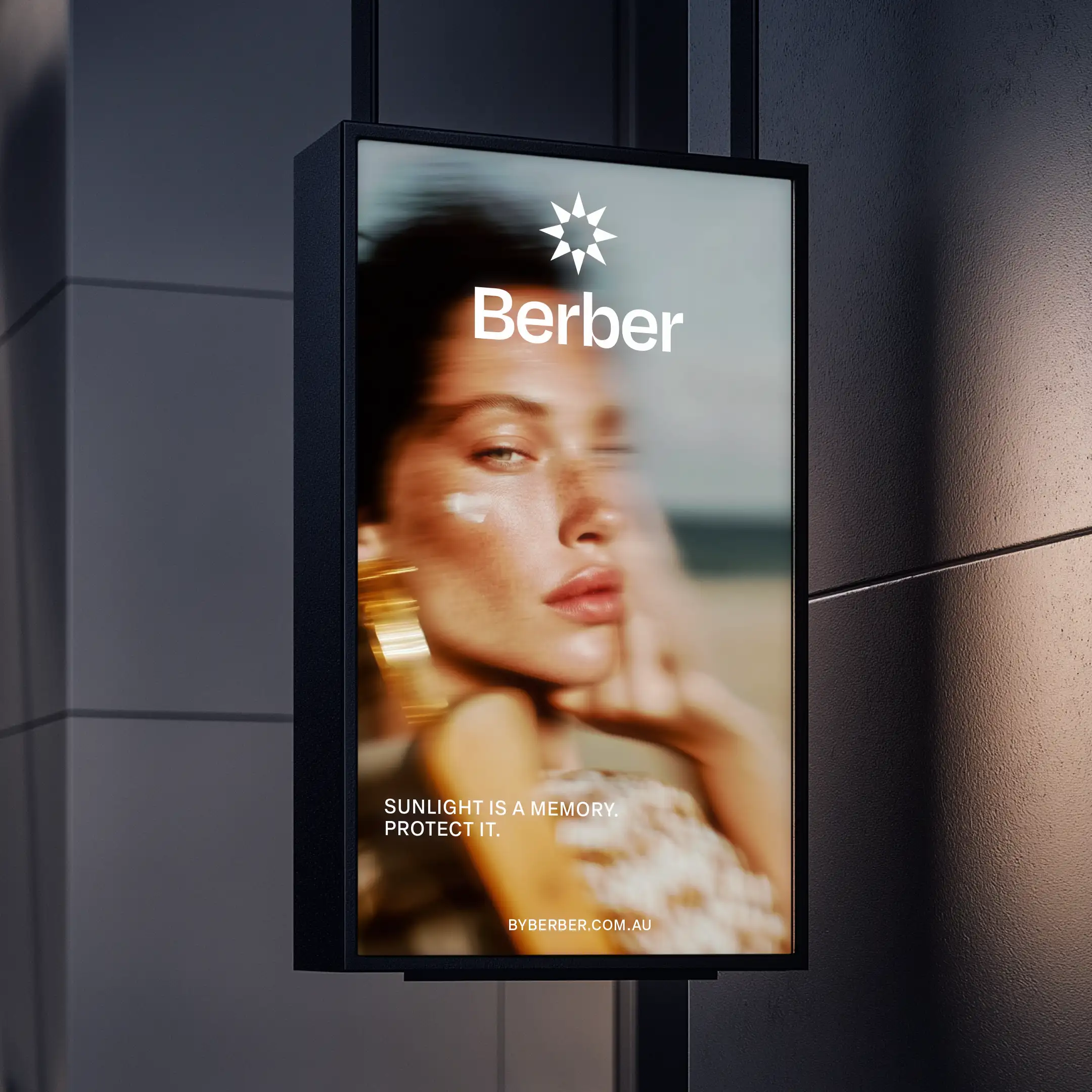 Berber skincare billboard ad, woman with sunscreen, "SUNLIGHT IS A MEMORY. PROTECT IT."
