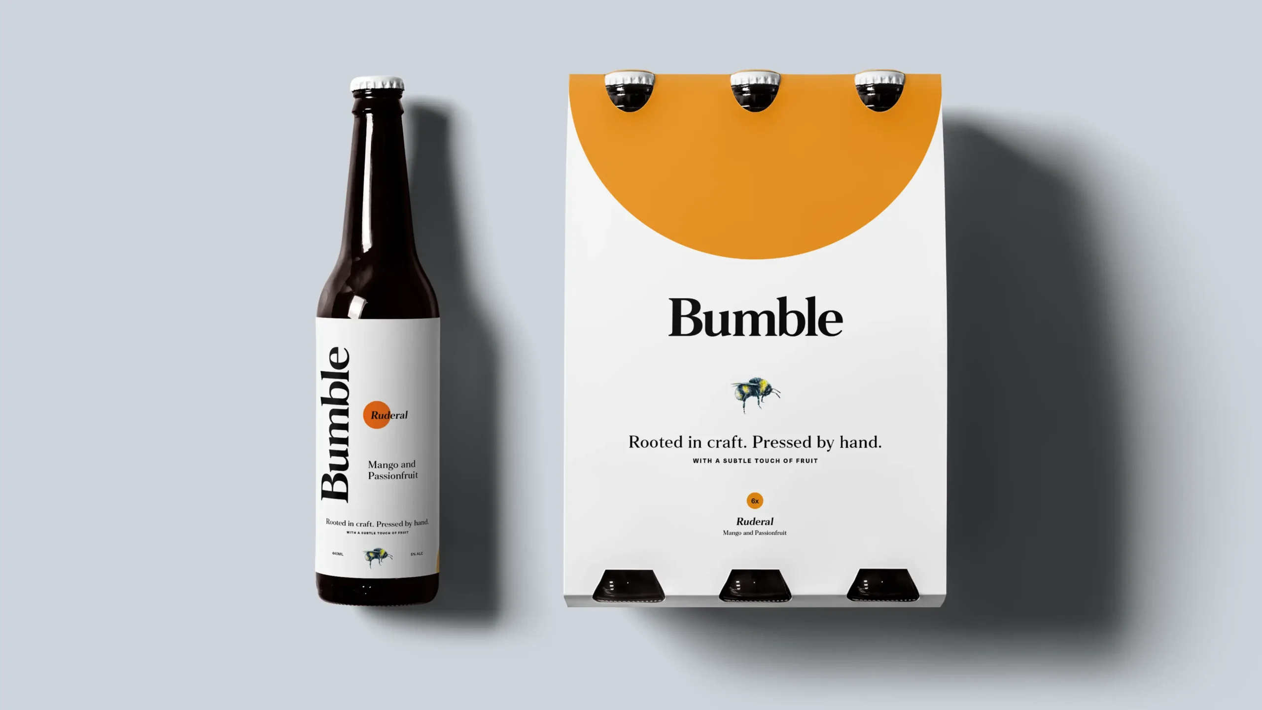 A single cider bottle and a branded 6-pack packaging in Ruderal flavor (Mango and Passionfruit).